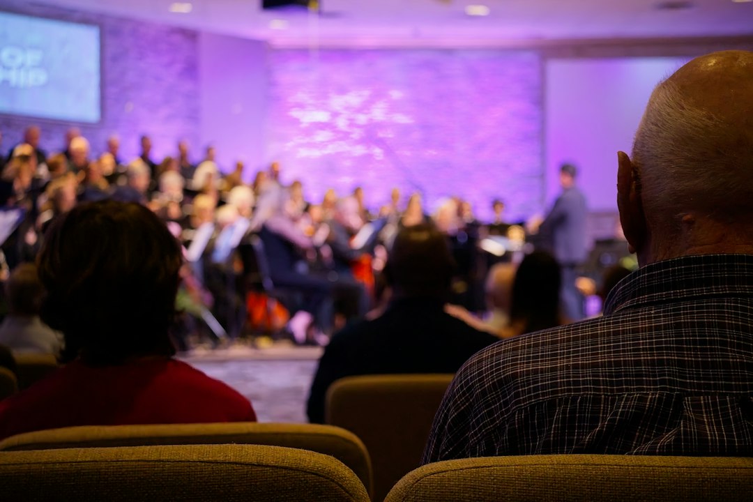 Audience watches a choir perform on stage